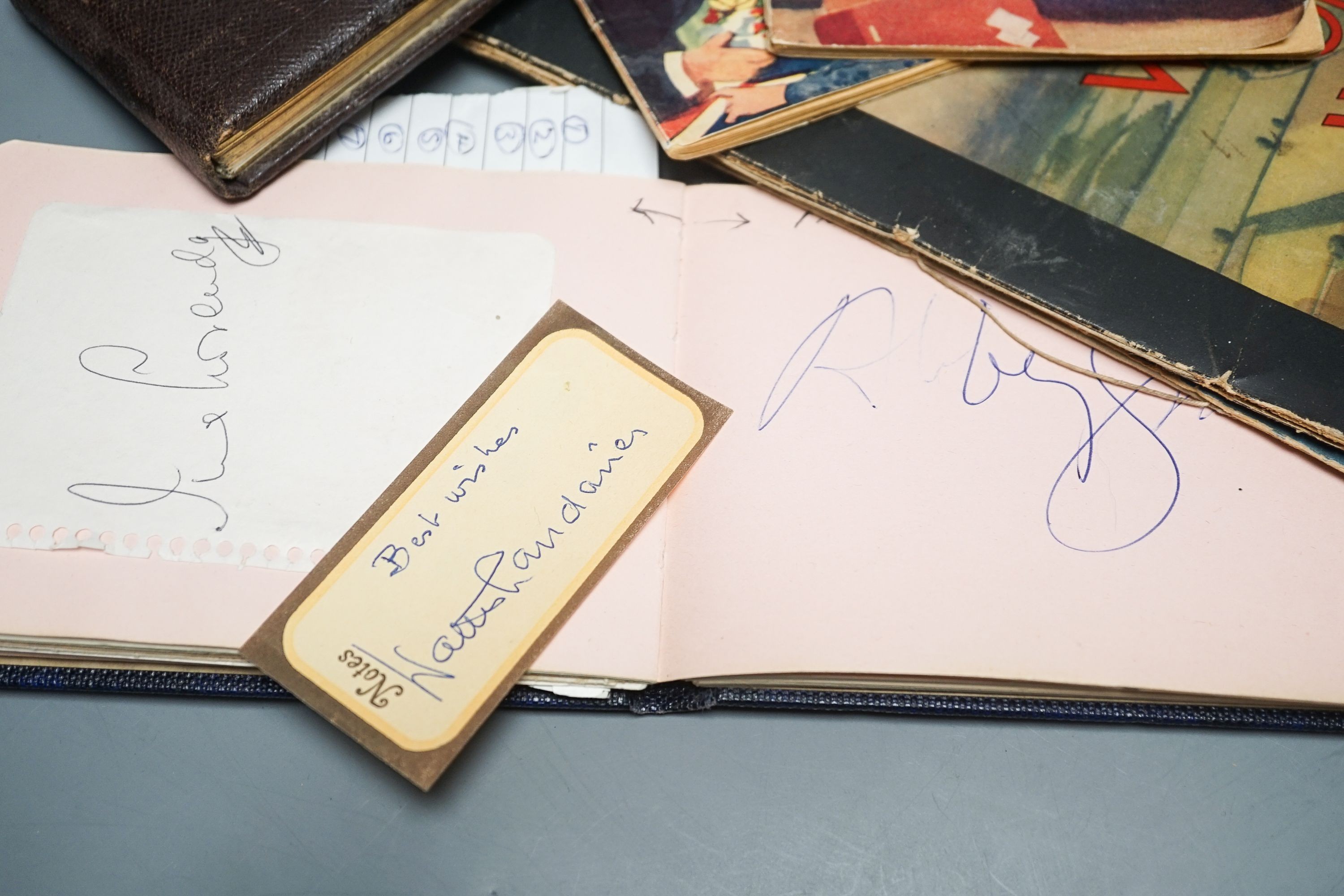 Autographs in two books mainly musicians and sundry ephemera.